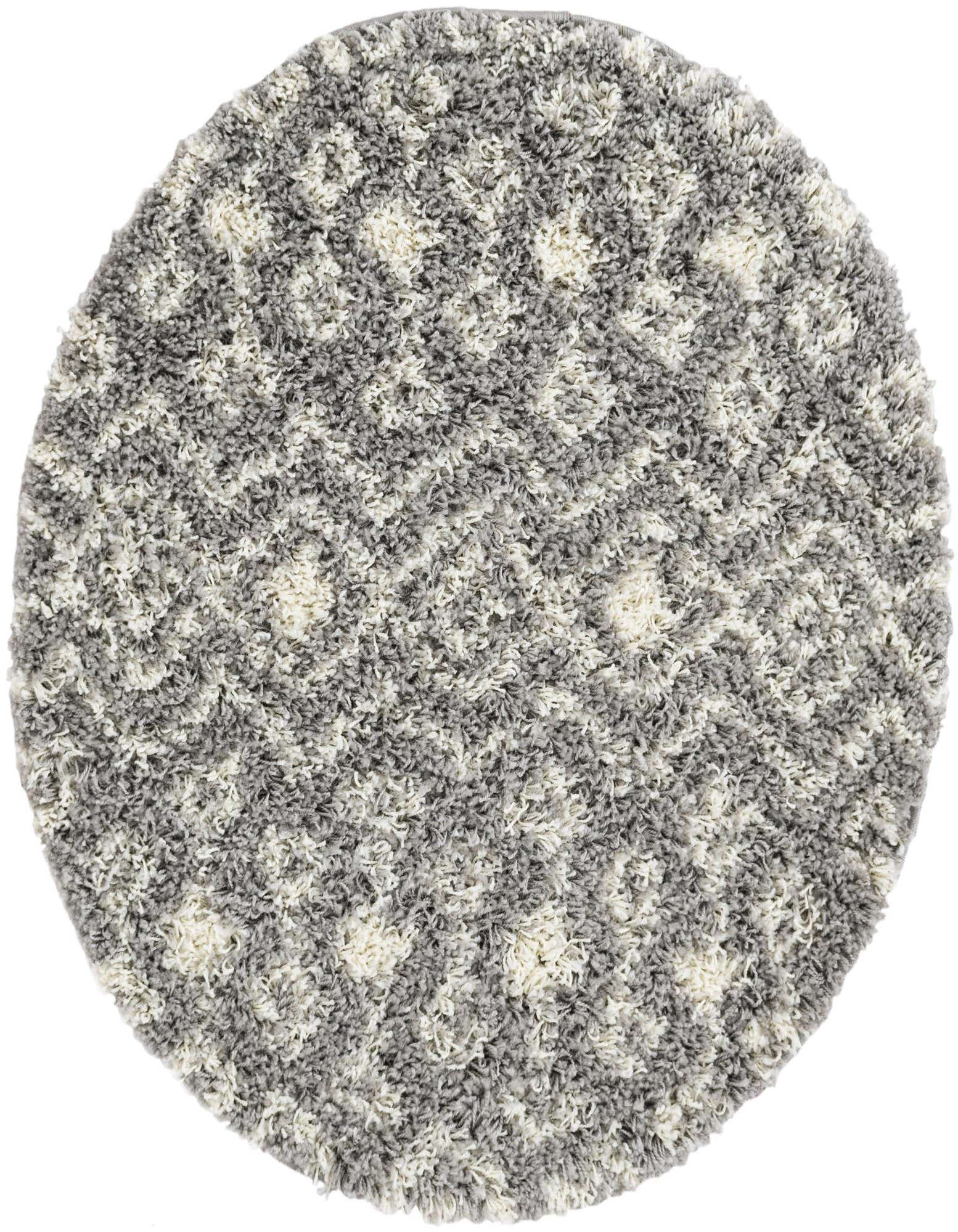 A round, gray and white shag rug with a subtle tribal pattern, featuring a plush, textured pile.