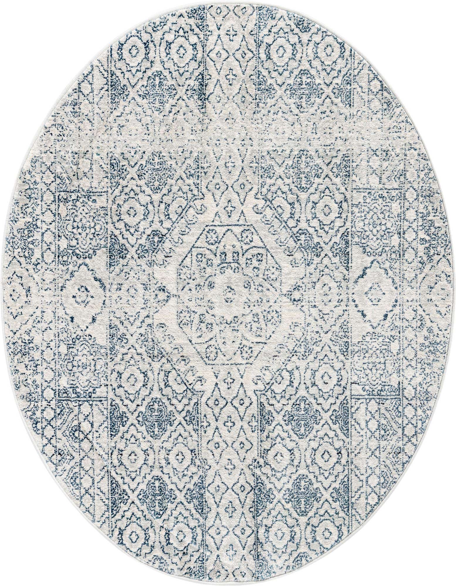 A 4' round gray and silver rug with a distressed traditional medallion and tribal pattern.