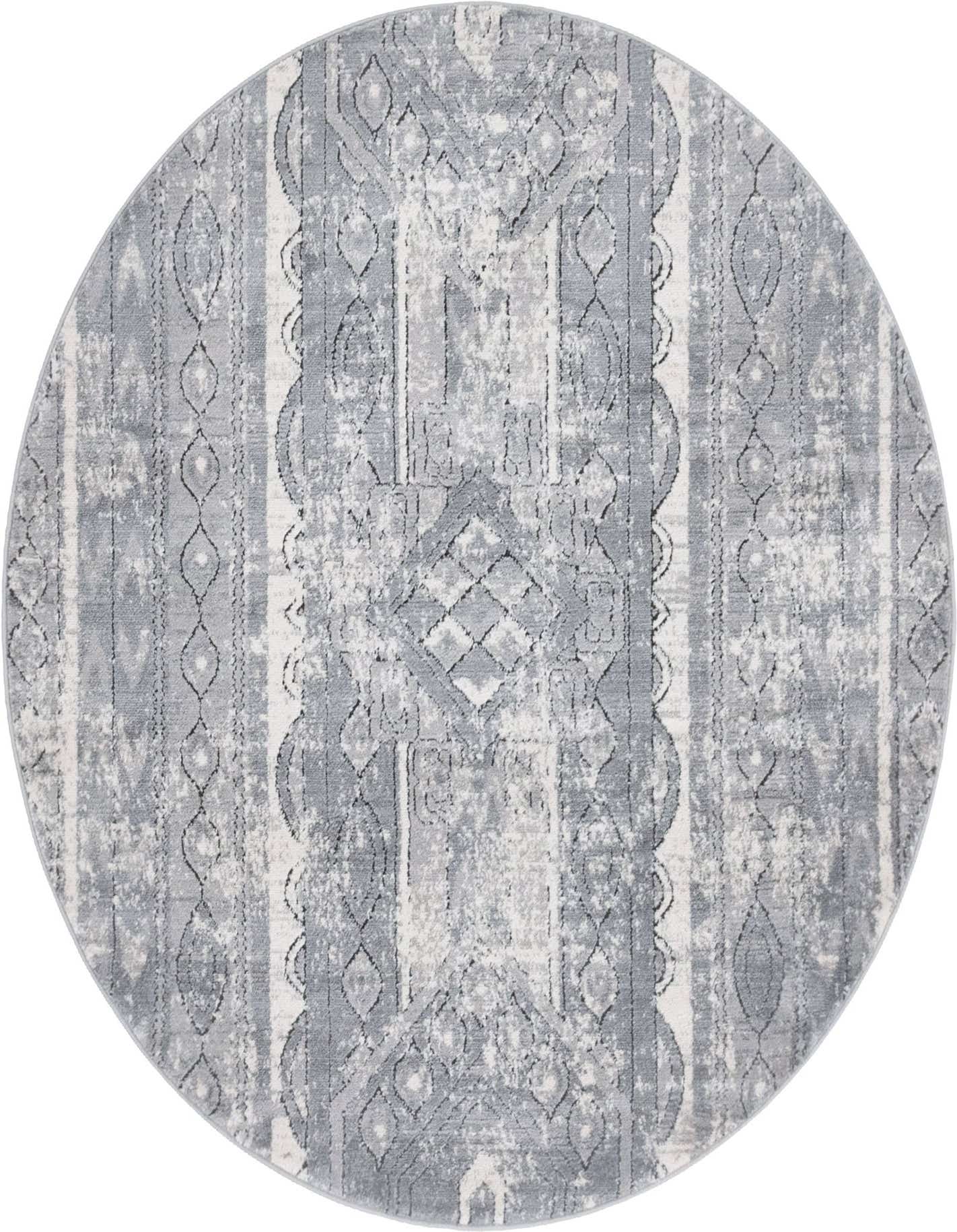 A 5' 3 round gray Bohemian rug with a distressed tribal pattern in varying shades of gray and silver.