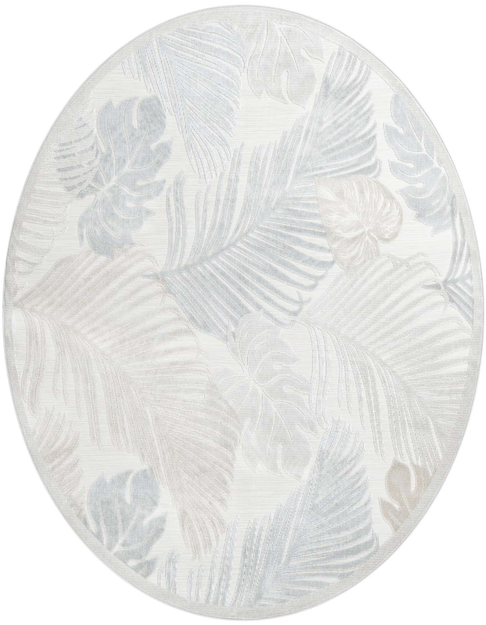 A round, flatweave indoor/outdoor rug featuring a tropical leaf pattern in various shades of gray and silver.