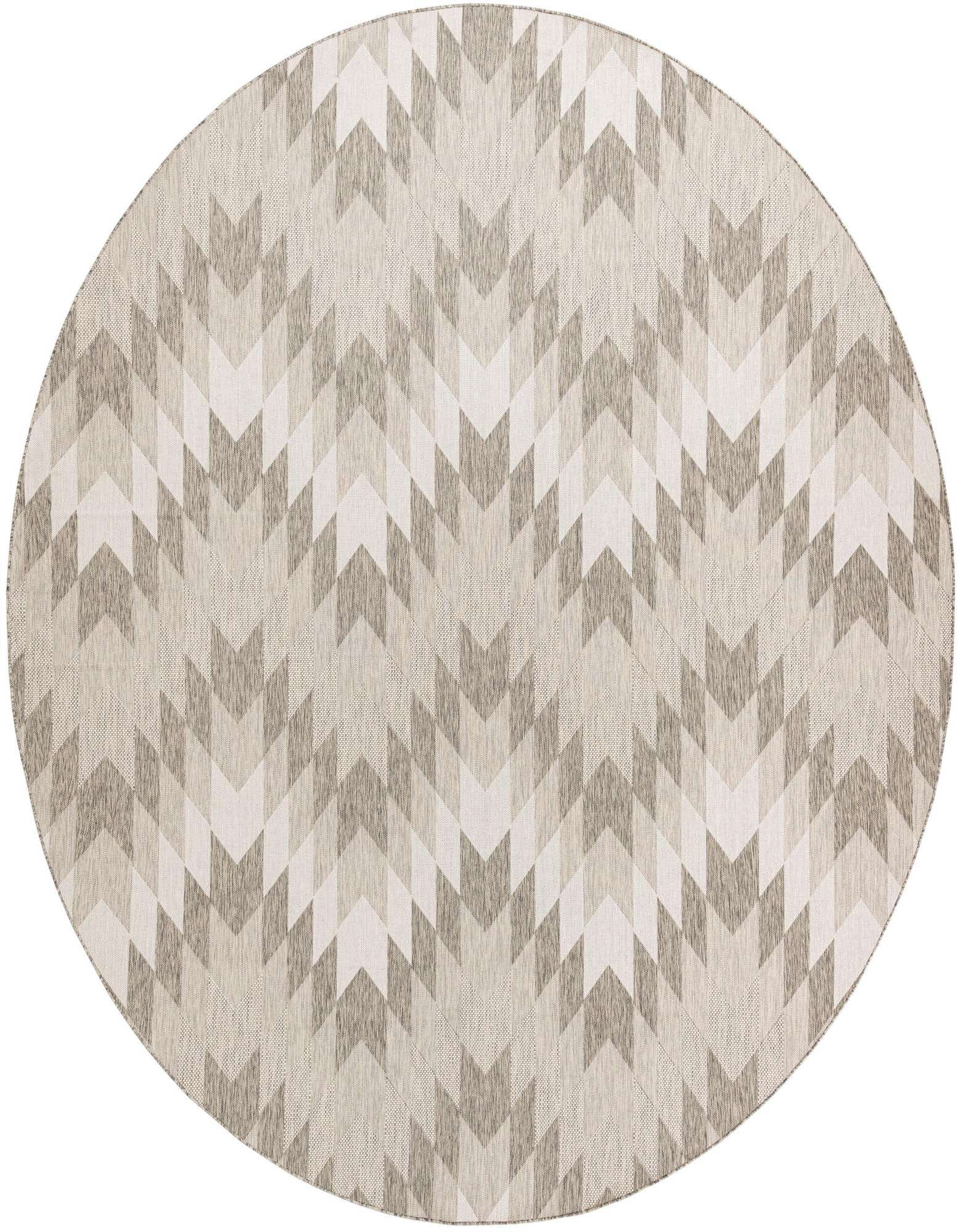 A large round gray and silver modern rug with a repeating geometric chevron pattern, suitable for indoor or outdoor use.