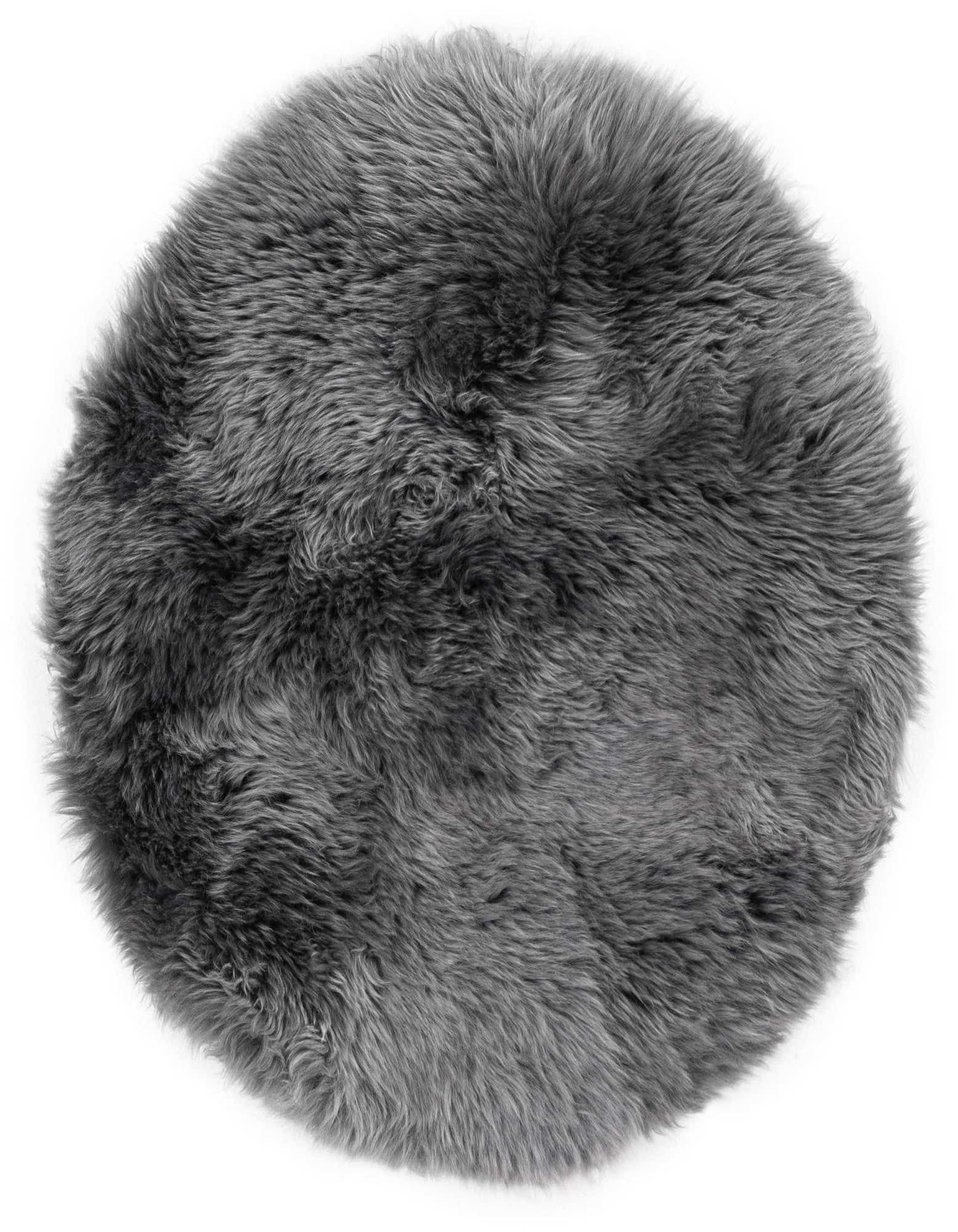 A soft, round 2' 0 x 2' 0 gray lambskin rug with a medium, textured pile, perfect for adding warmth.