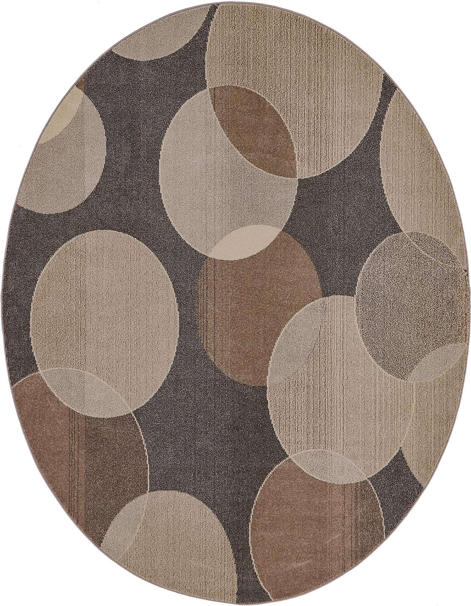 A round Theia rug featuring an abstract pattern of overlapping circles in various shades of gray and silver.