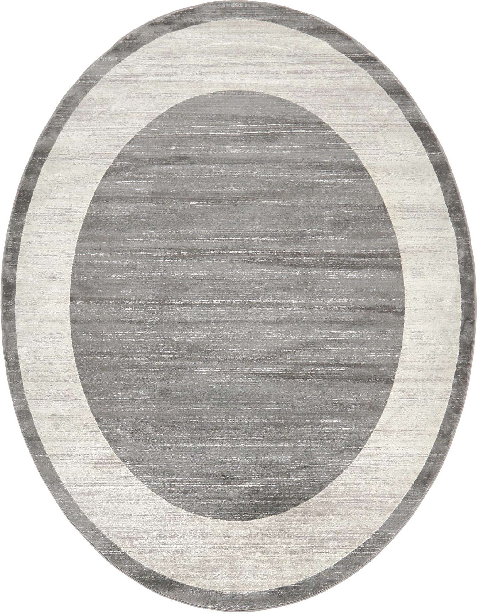 A round gray and silver transitional rug featuring a modern concentric circle design with a textured pile.
