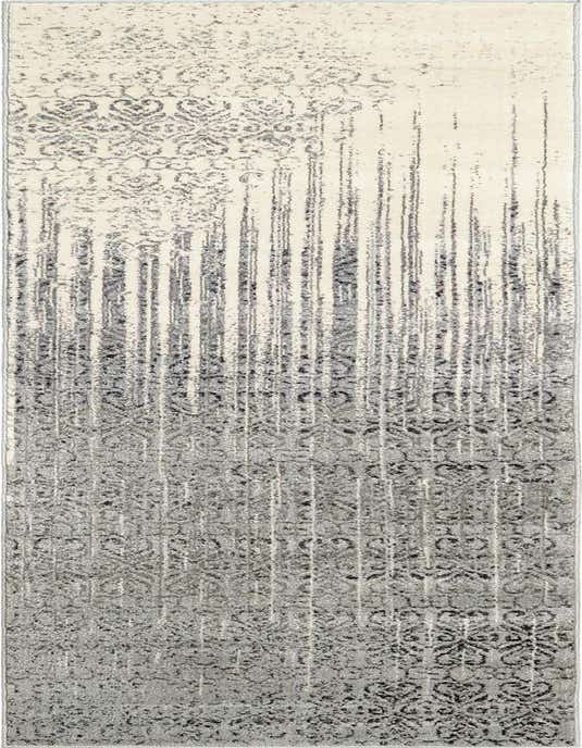 A 10 ft runner rug in shades of gray and silver, featuring a transitional abstract pattern with distressed vertical lines and subtle medallions.