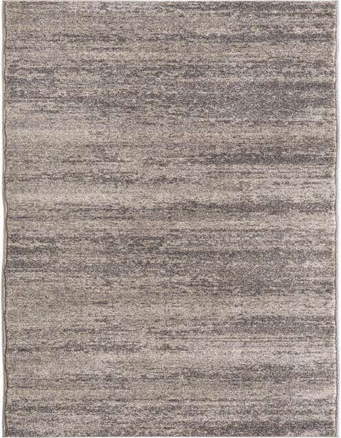 A long 11 ft runner rug in varying shades of gray, featuring a textured, abstract pattern, perfect for a hallway.