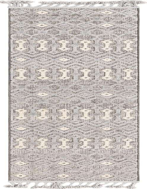 A gray 8 ft runner rug with a tribal pattern featuring textured high-low pile and decorative tassels on both ends.