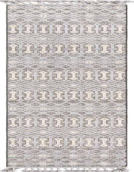 A 12 ft runner rug featuring a tribal pattern in varying shades of gray and silver with textured high-low pile, perfect for a hallway.