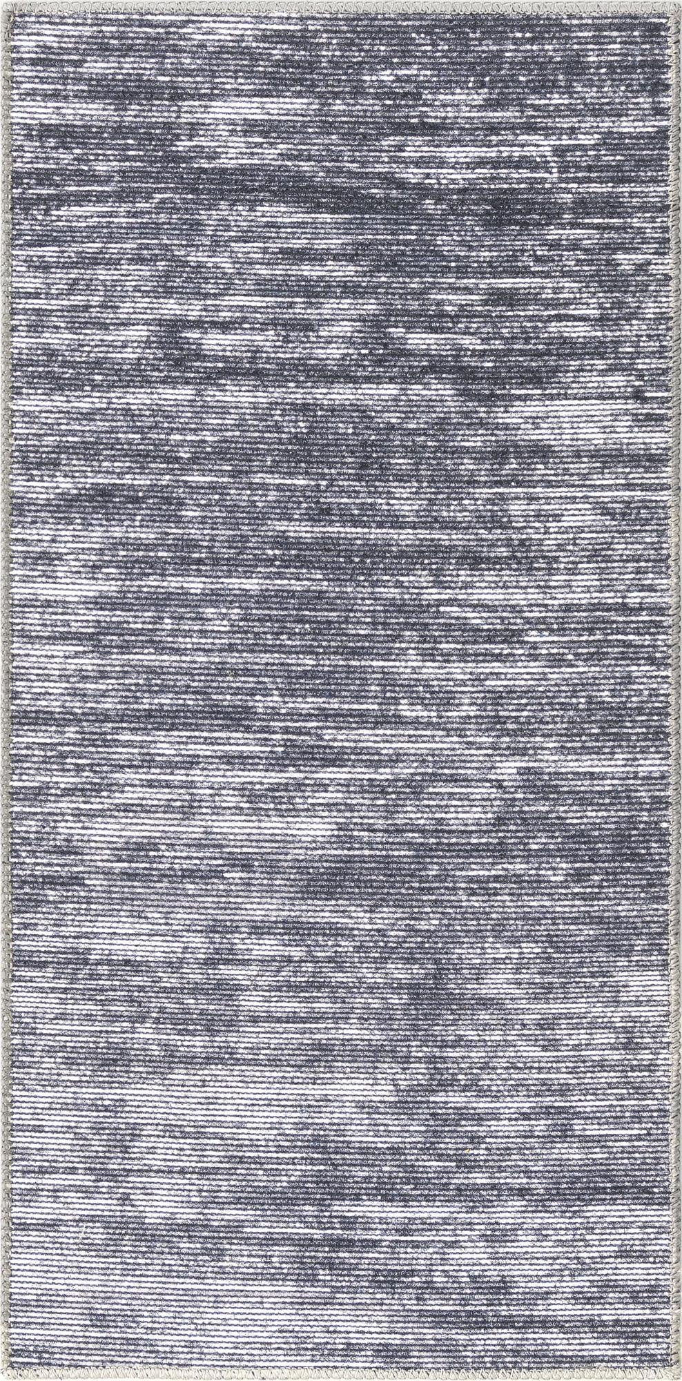 A close-up view of a gray and silver modern runner rug with a textured, striped pattern, perfect for a hallway.
