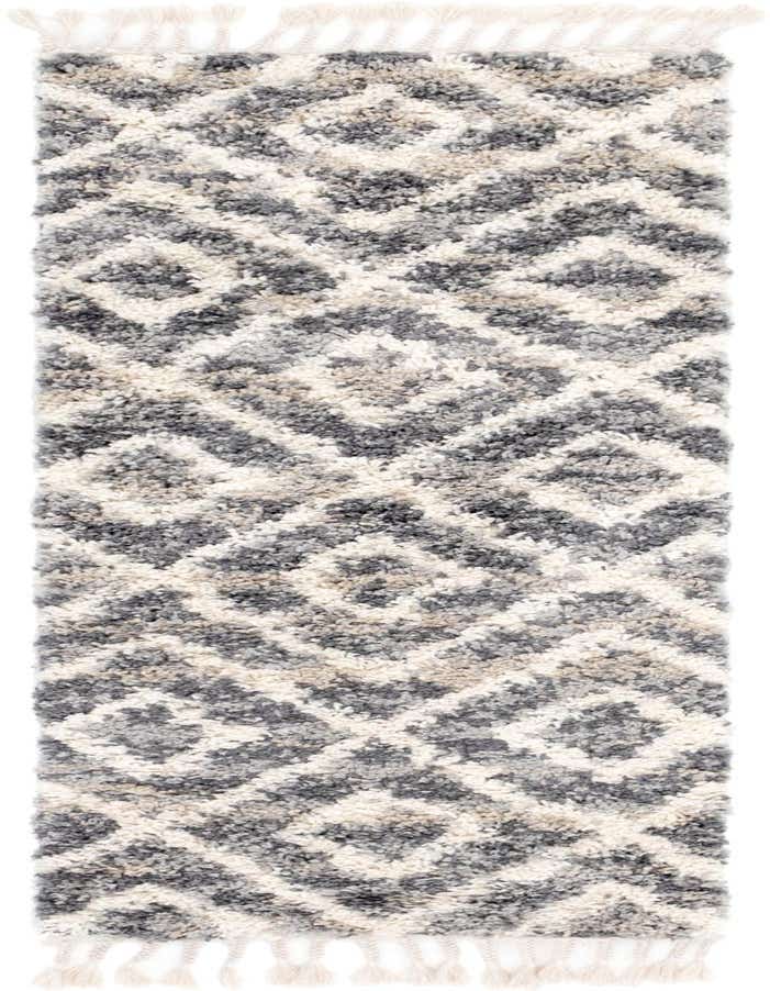 A 6 ft runner rug from the Athena Shag collection, featuring a gray and off-white tribal geometric pattern with tassels, ideal for hallways.