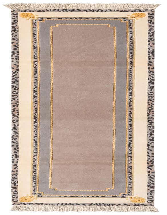 A 10 ft Darya runner rug in grays and silvers with a modern Persian pattern, featuring a central taupe field, a gray border, and an outer cream border with a subtle leopard print and gold accents, all finished with fringe.