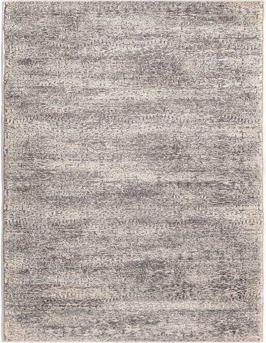 A long 8 ft runner rug in shades of gray and silver with a modern, distressed solid pattern, ideal for a hallway.