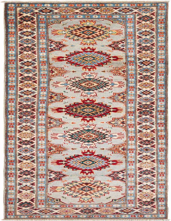 A 10 ft runner rug with a gray background and a repeating pattern of colorful geometric medallions in red, blue, and orange, framed by patterned borders.