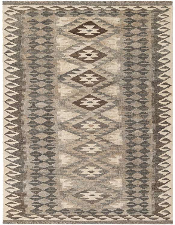 A 10 ft runner rug in shades of gray and silver, featuring a tribal geometric pattern, made from flatweave wool.