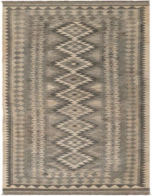 A 9 ft runner rug with a tribal geometric pattern in varying shades of gray and beige, ideal for a hallway.