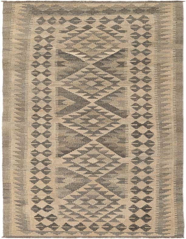 A 10 ft runner rug in grays and silvers, featuring a tribal geometric pattern, ideal for a hallway.