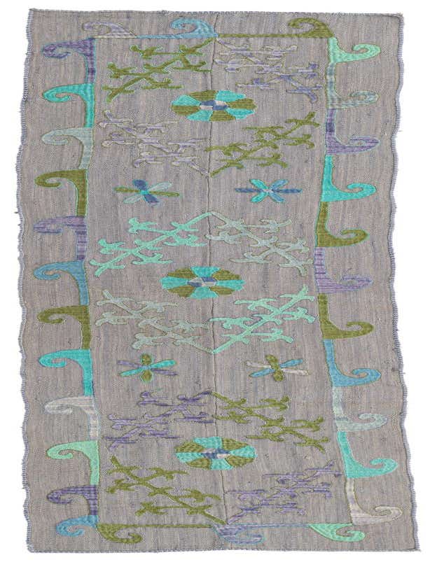 A gray 8 ft runner rug with colorful tribal and floral patterns in blue, green, and purple.