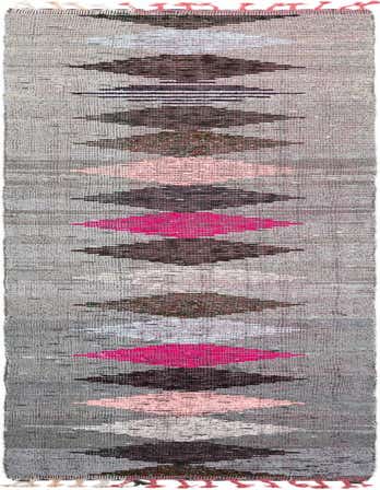 A gray 16 ft runner rug with a tribal pattern of alternating pink, white, and dark gray diamond shapes.