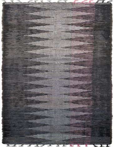 A long 14 ft gray wool runner rug with a modern tribal pattern and shag pile, ideal for a hallway.