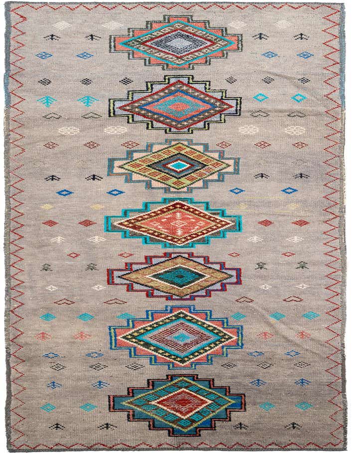 A 14 ft gray wool runner rug with a shag pile, featuring colorful tribal geometric diamond patterns in a hallway.