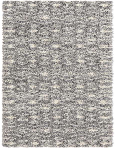 A 12 ft runner rug with a gray and silver tribal pattern, featuring a textured shag pile.