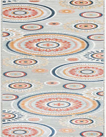 A 12 ft runner rug with a gray background and large, colorful abstract circular patterns in orange, blue, and white.