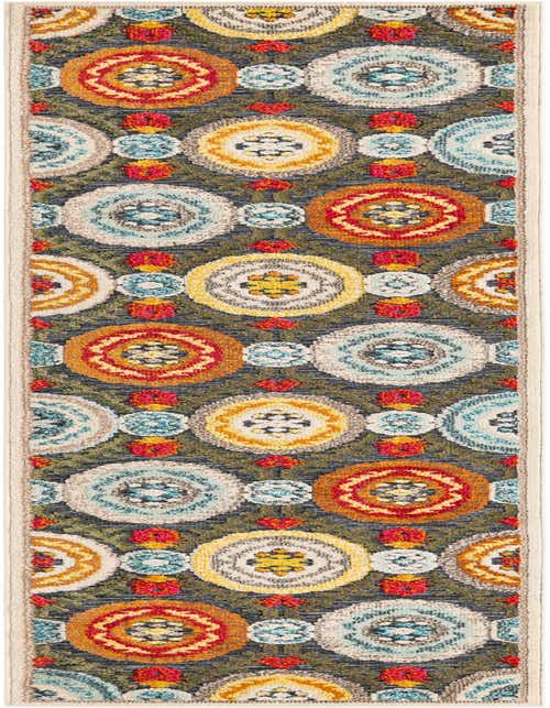 A 10 ft runner rug with a modern pattern of colorful medallions in gray, red, yellow, and blue, suitable for a hallway or patio.