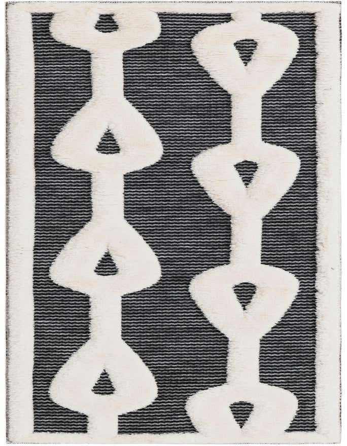 A 6 ft runner rug with a bold black and white geometric chain link pattern, featuring a textured pile.