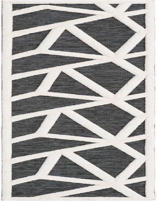 A 10 ft runner rug in gray and white with a bold geometric pattern, ideal for a modern hallway.