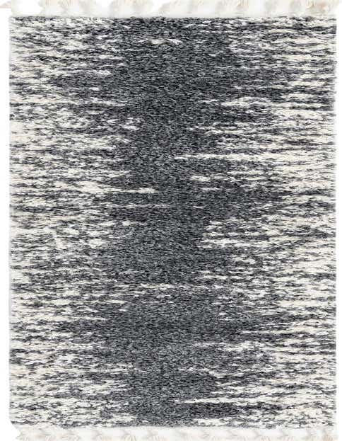 A gray and silver Serenity Shag runner rug with a textured, abstract pattern and white tassels.
