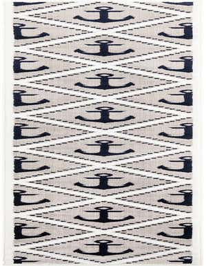A 13 ft runner rug with a modern nautical pattern featuring navy anchors within gray diamonds on a white background.
