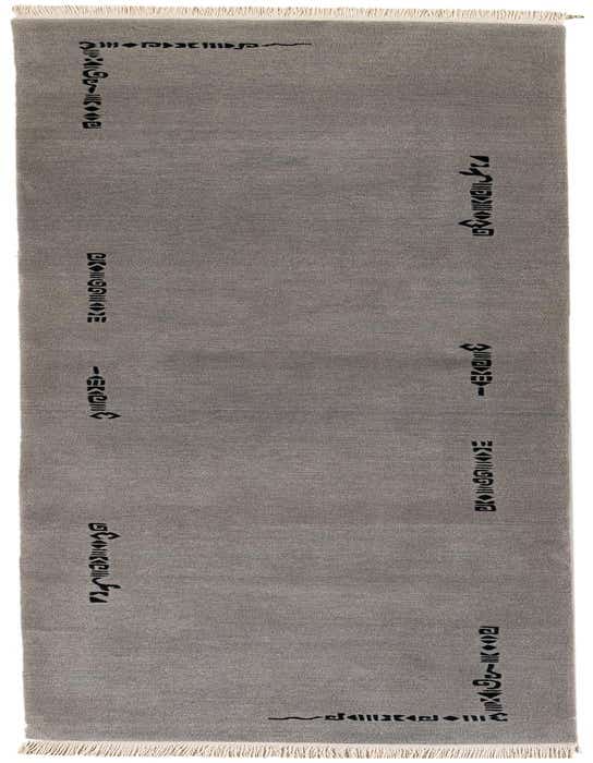 A handmade 11 ft gray wool runner rug with a modern oriental pattern in black, ideal for a hallway.