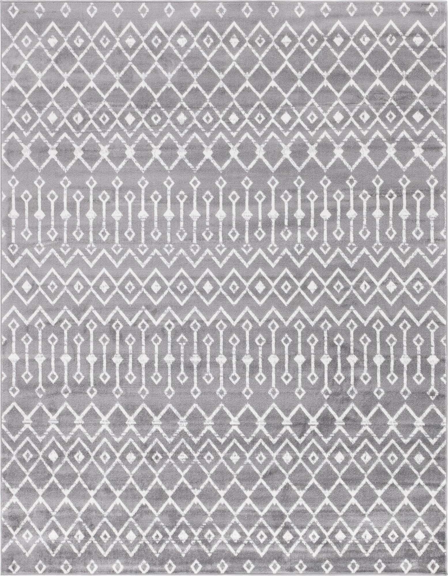 A square gray and white tribal trellis rug with a repeating geometric pattern, perfect for a modern living space.