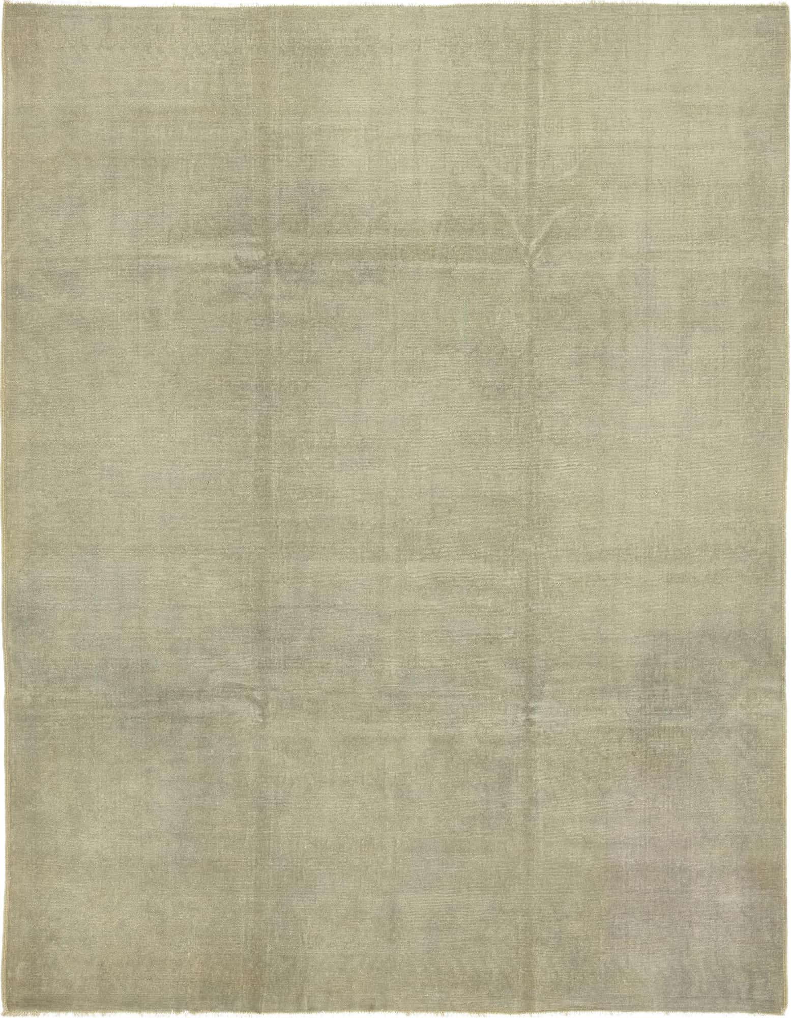 A large 8' x 9' square, hand-spun wool rug in a solid gray/silver color with subtle vintage oriental patterns.