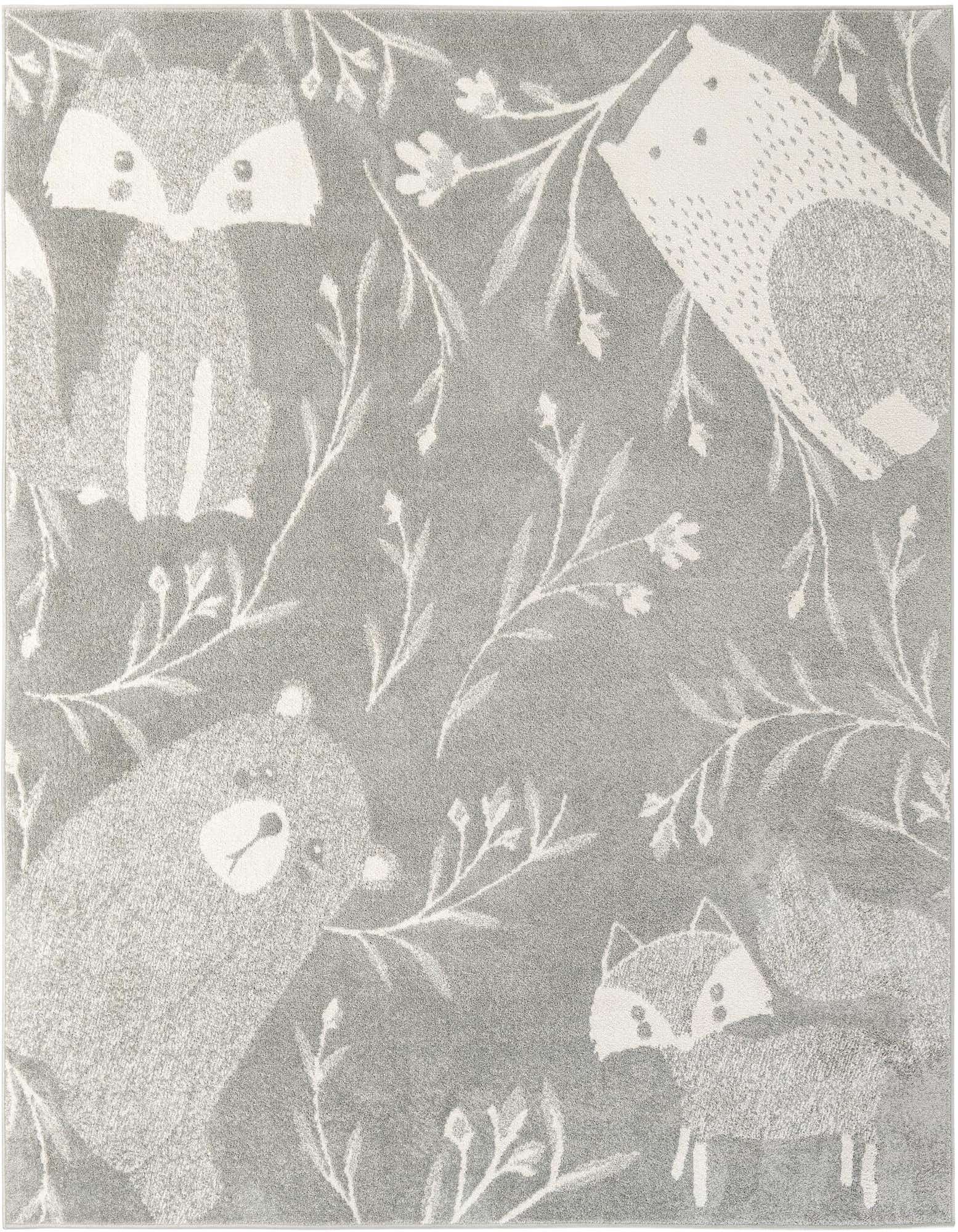 A square gray rug featuring a playful modern pattern of white woodland animals like foxes and bears, surrounded by delicate white foliage.