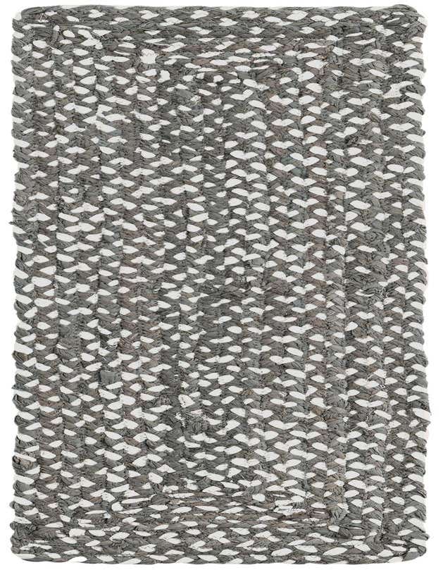 A 1' 2 x 4' 1 gray and white braided chindi table runner with a textured, flatweave pattern.