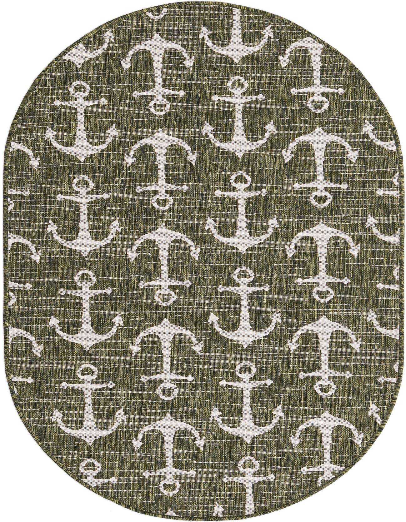 An oval green indoor/outdoor rug with a repeating pattern of white anchors, perfect for a patio.