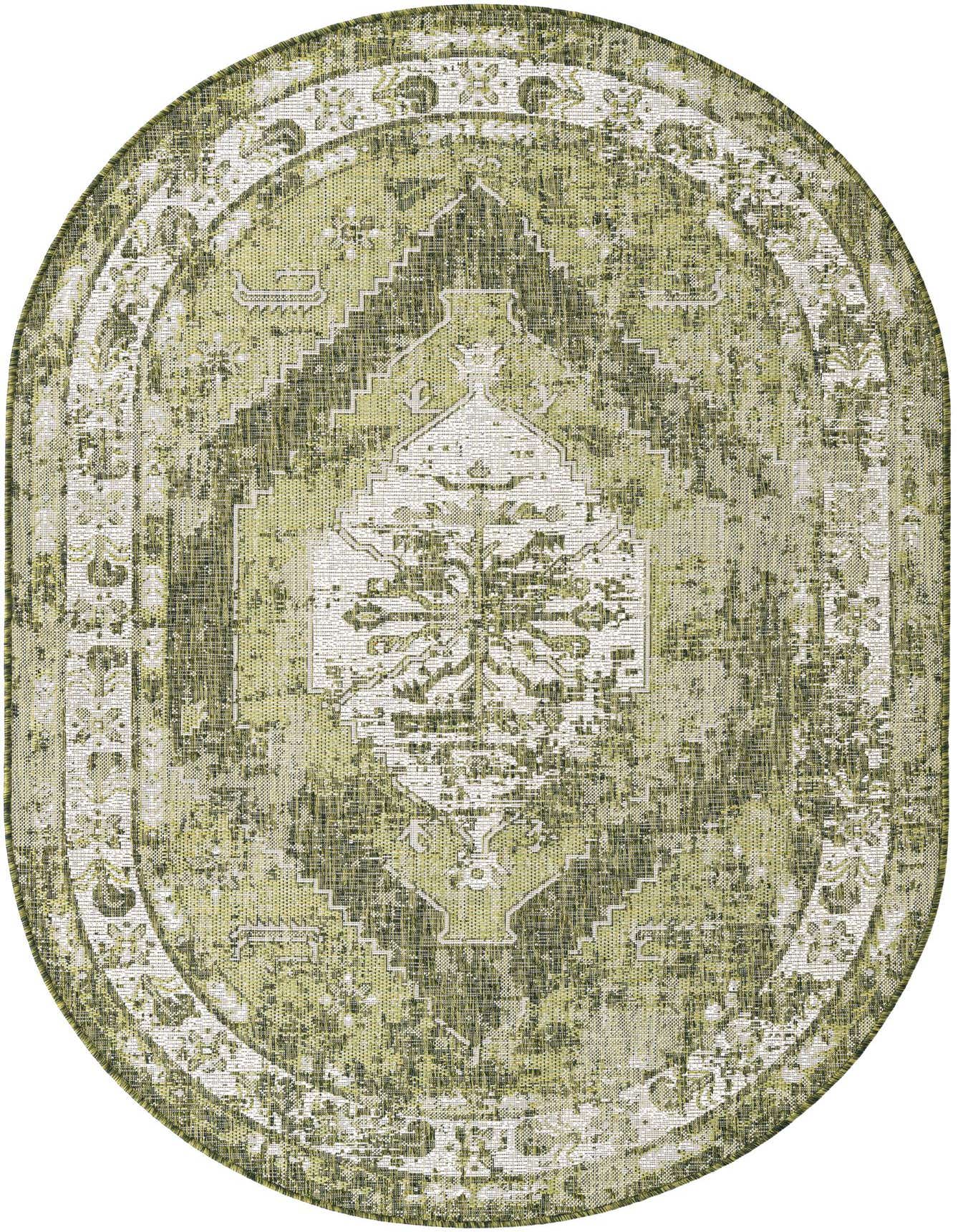 A 5'3" x 8'0" oval green Southwestern rug with a distressed traditional pattern, suitable for indoor or outdoor use.