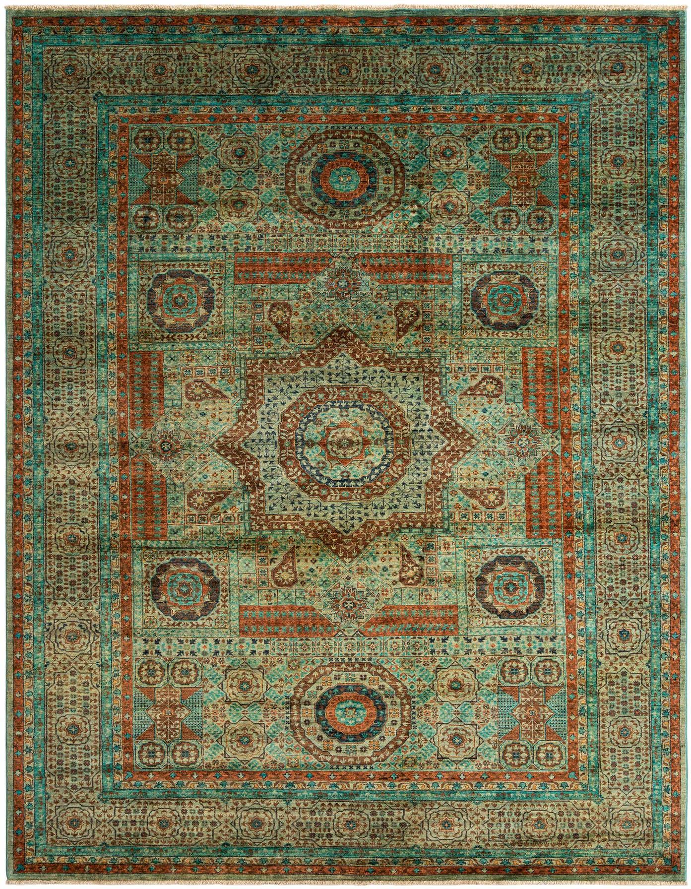 A rectangular handmade Persian rug featuring intricate green, teal, and rust patterns with a central medallion and ornate border.