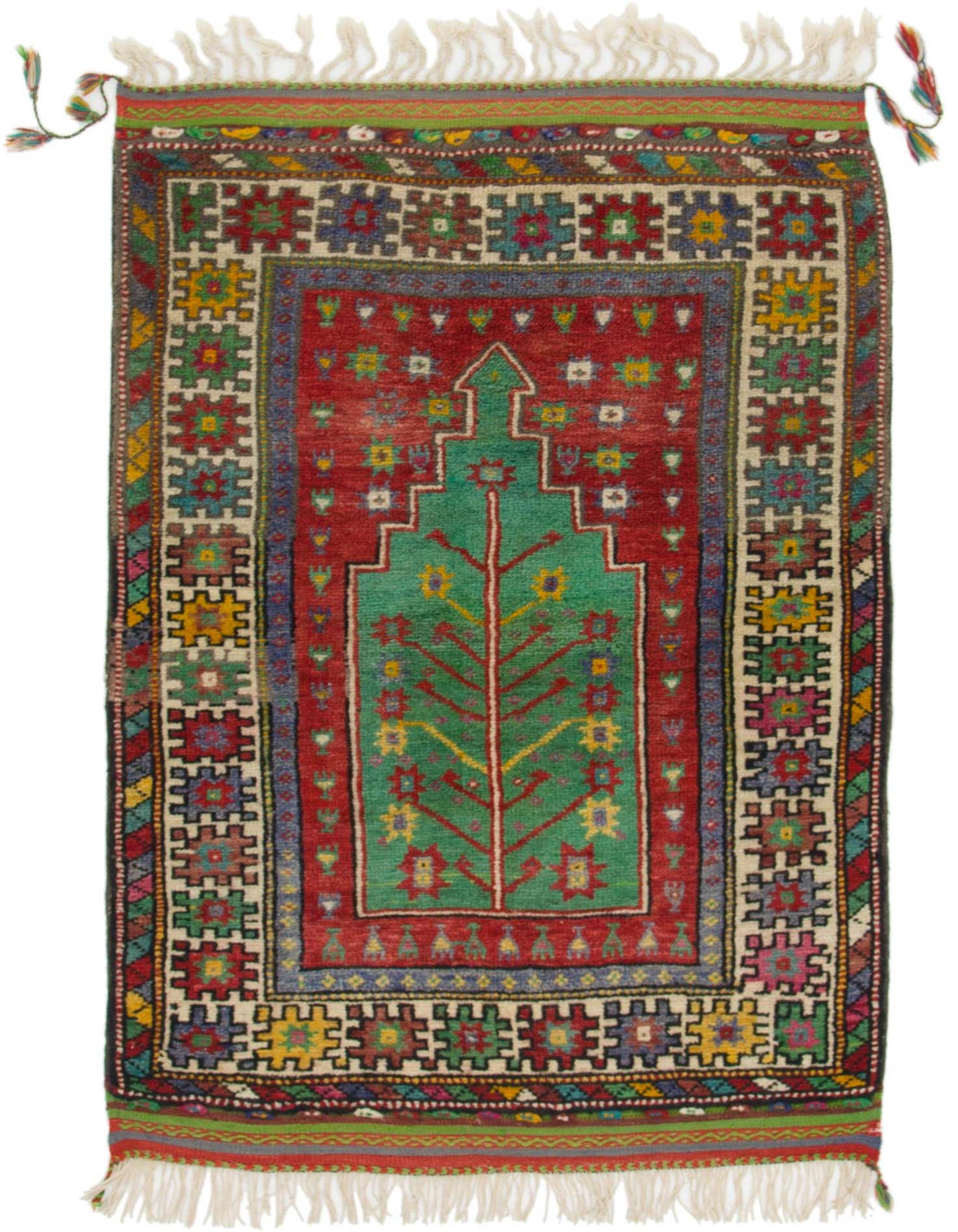 A vibrant 3x5 rectangular Anatolian wool rug featuring a central green tree-of-life motif on a red field, surrounded by tribal patterns in various colors, with white fringes.