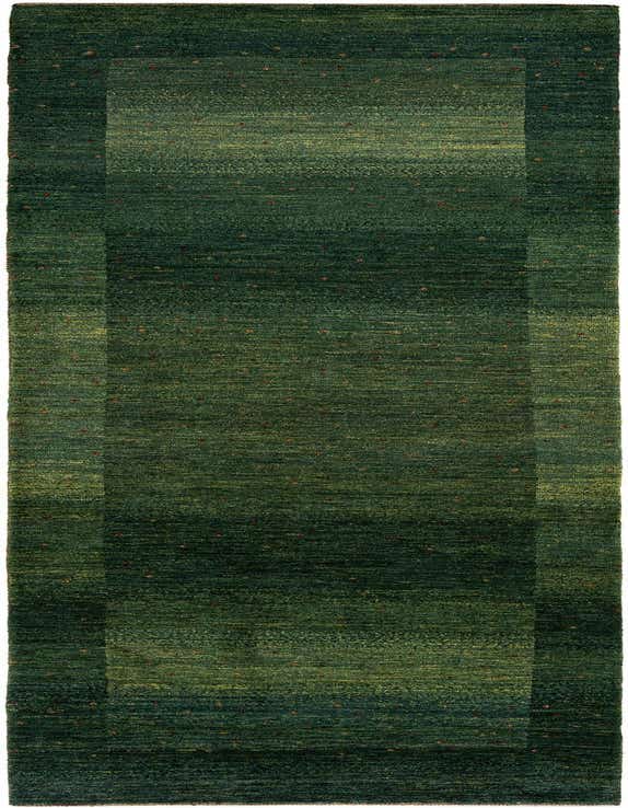 A handmade rectangular Kashkuli Persian rug in varying shades of green with a subtle border and small red accents.