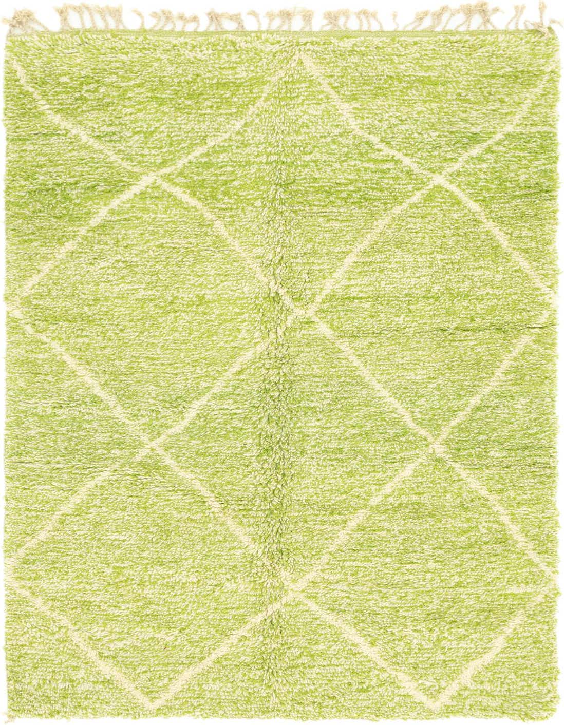 A 5x8 rectangular green shag rug with a cream tribal diamond pattern and fringe, perfect for a living room.