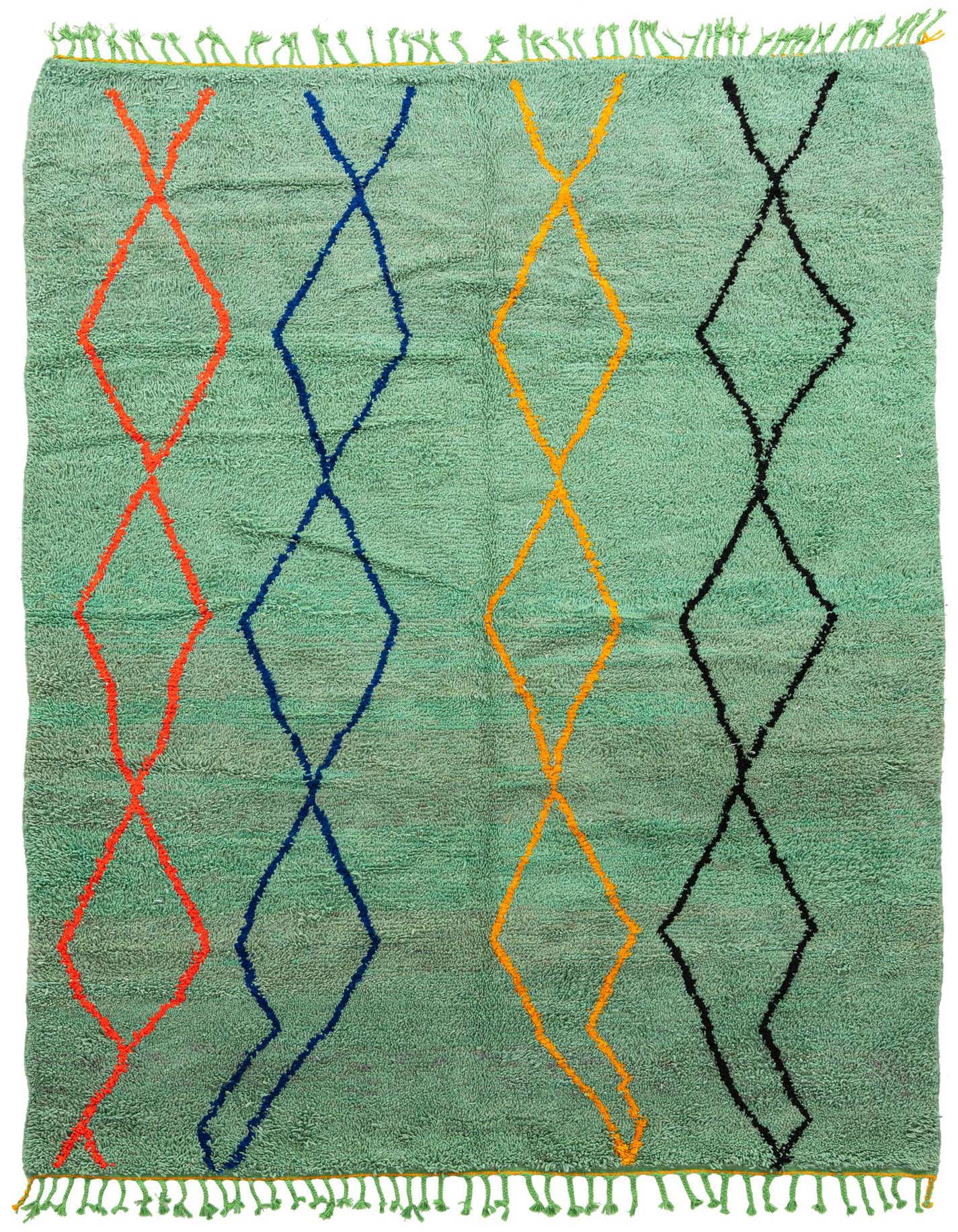 A 7x10 rectangular green shag rug with large orange, blue, yellow, and black diamond patterns.