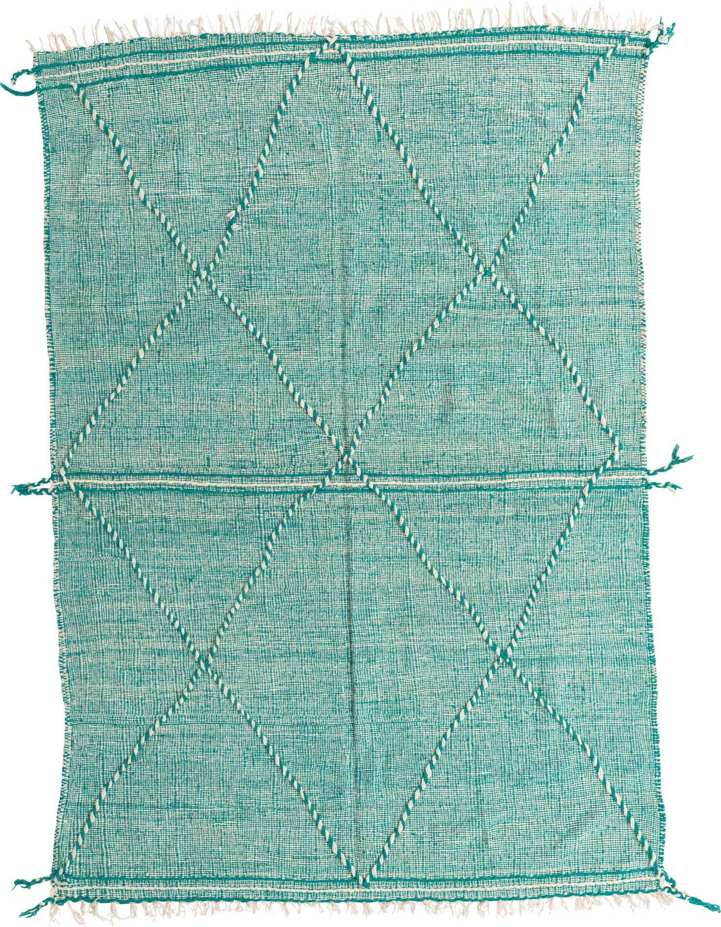 A rectangular 6x9 green tribal shag rug with white diamond patterns and fringe, suitable for a living room.