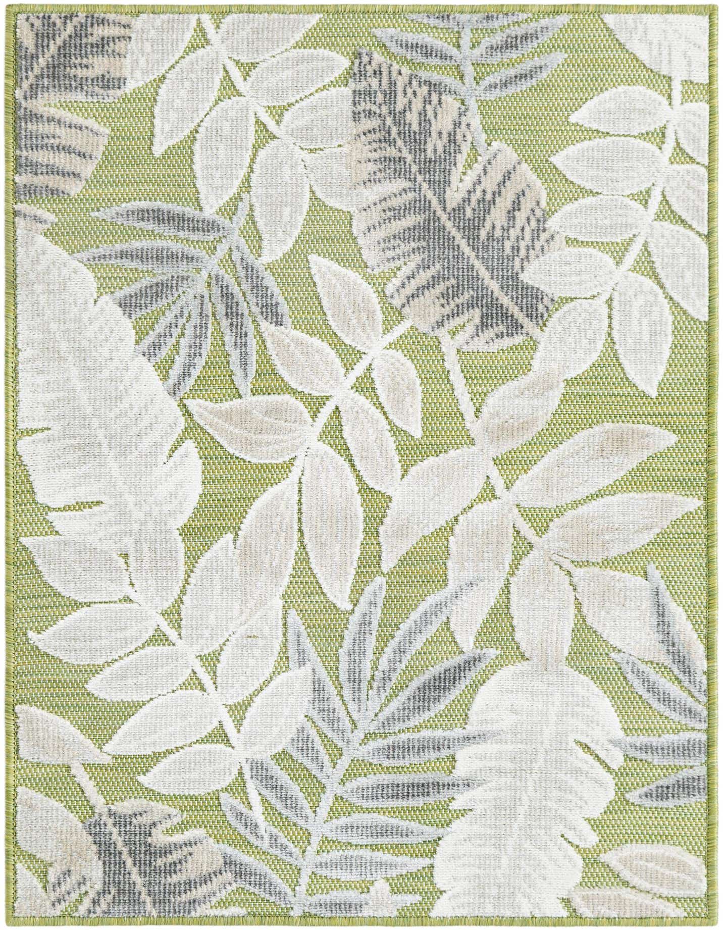 A 2x3 rectangular green indoor/outdoor rug with a tropical leaf pattern in white, grey, and light beige.