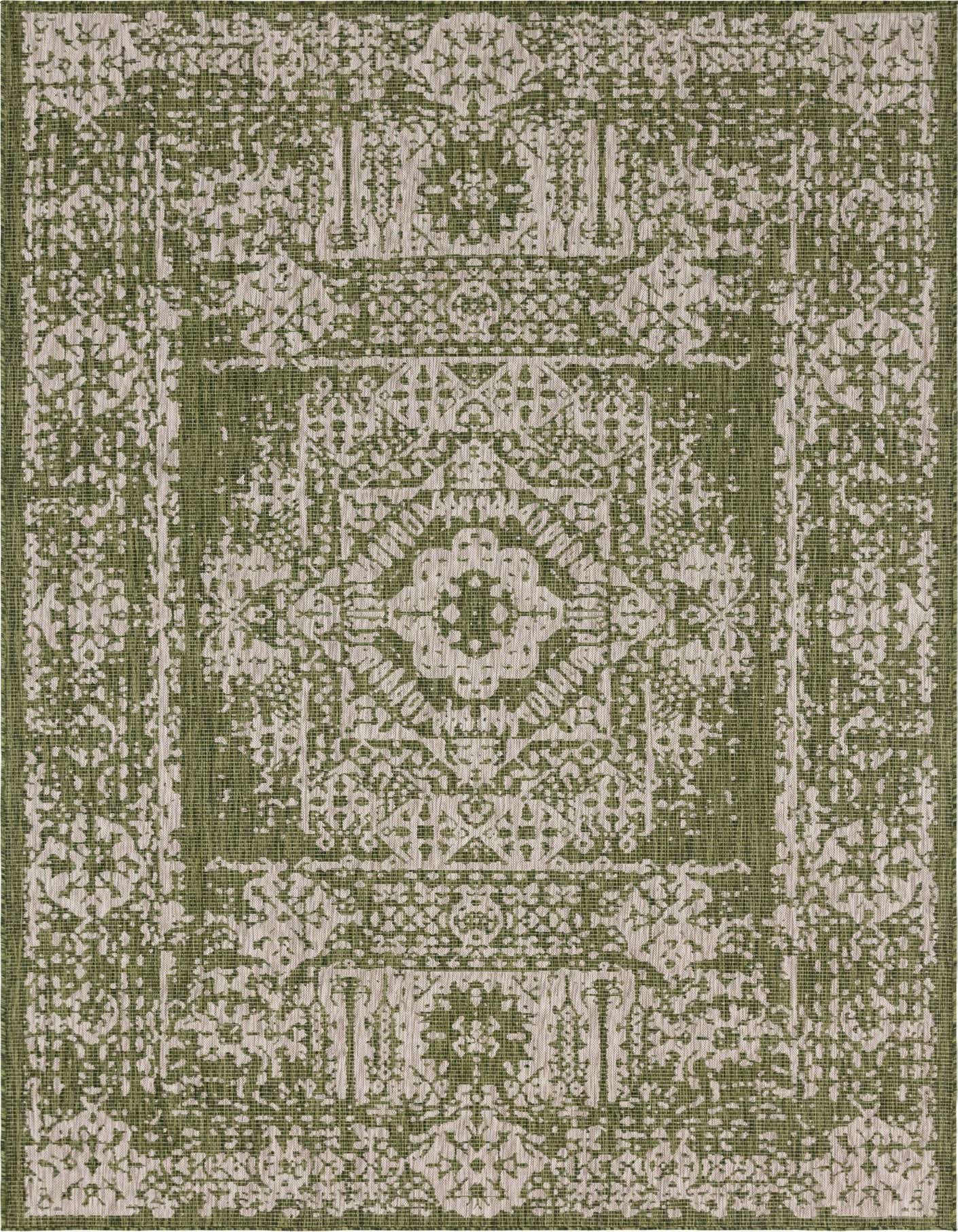 An 8x11 rectangular green and beige indoor/outdoor rug with a distressed Southwestern medallion pattern.
