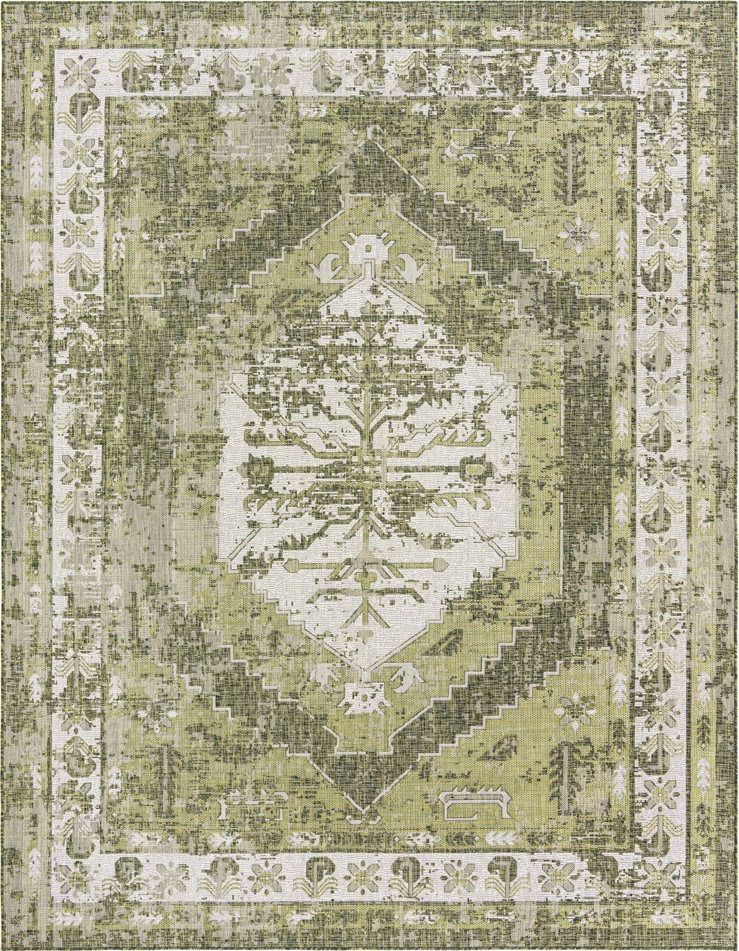 A 9x12 rectangular indoor/outdoor rug featuring a distressed Southwestern pattern in shades of green and cream.
