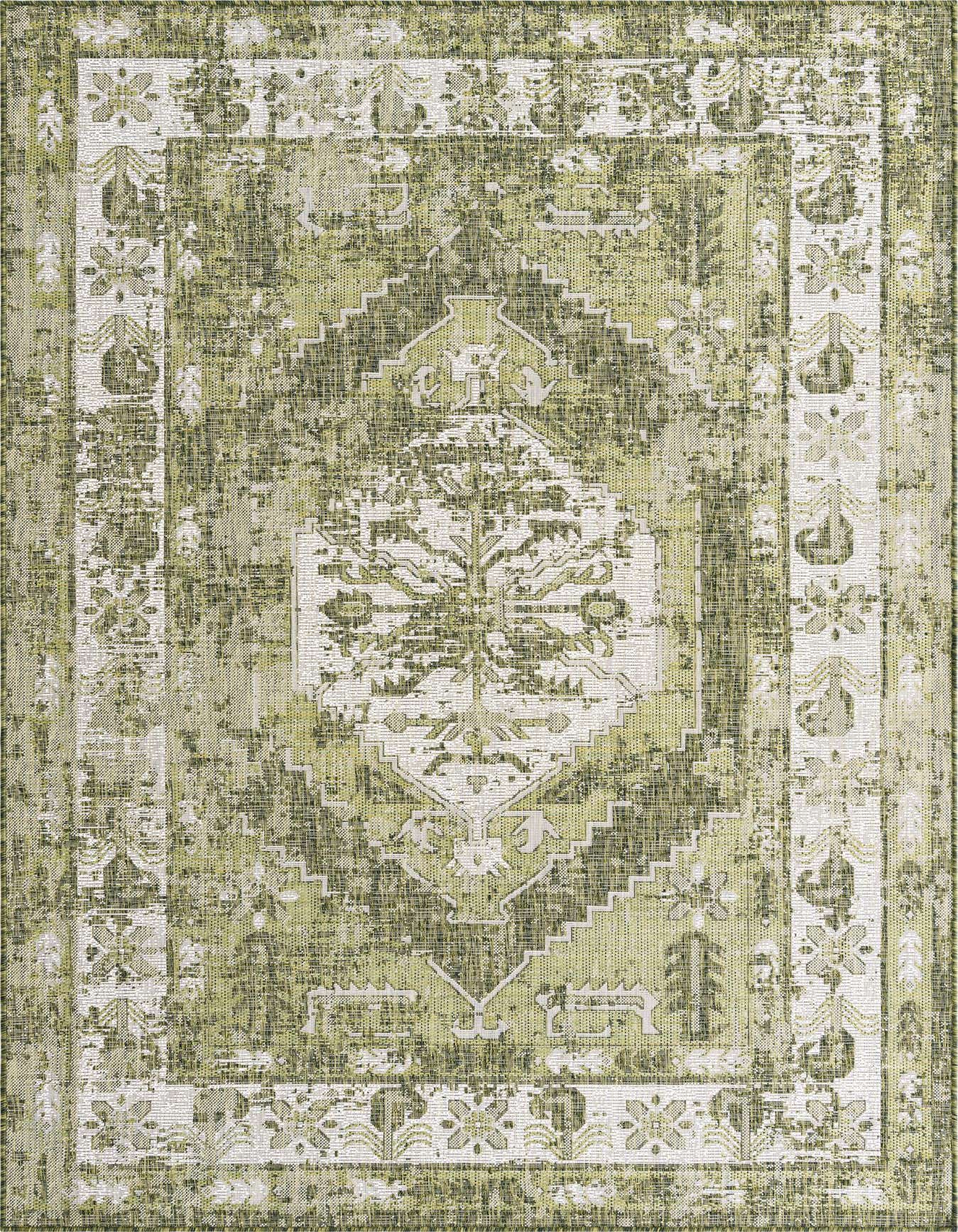 A 6x9 rectangular indoor/outdoor rug featuring a distressed green and white Southwestern pattern with a central medallion and border.