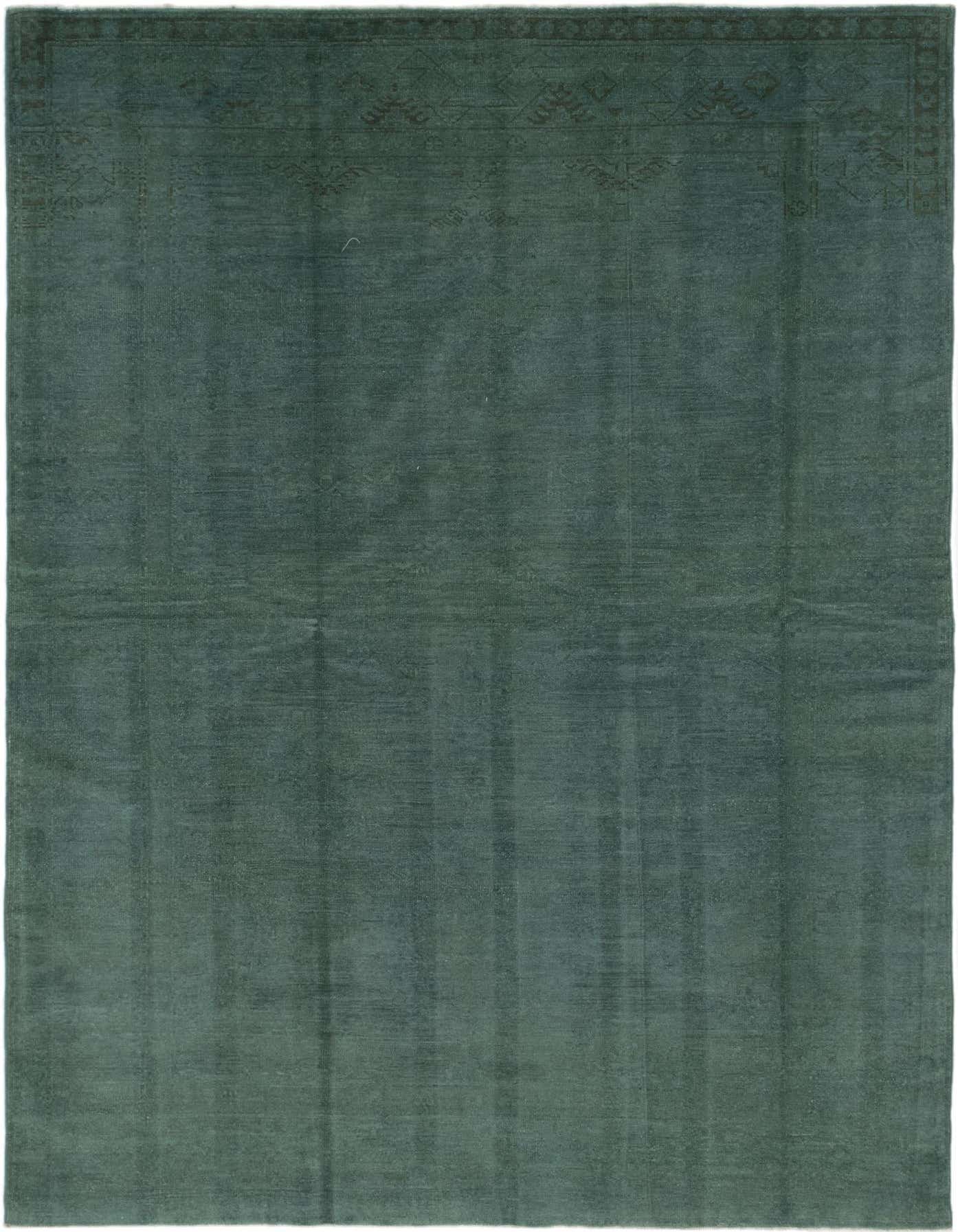 A 5x8 rectangular Over-Dyed Ziegler rug in deep green, featuring subtle transitional patterns along the border, ideal for a living room.