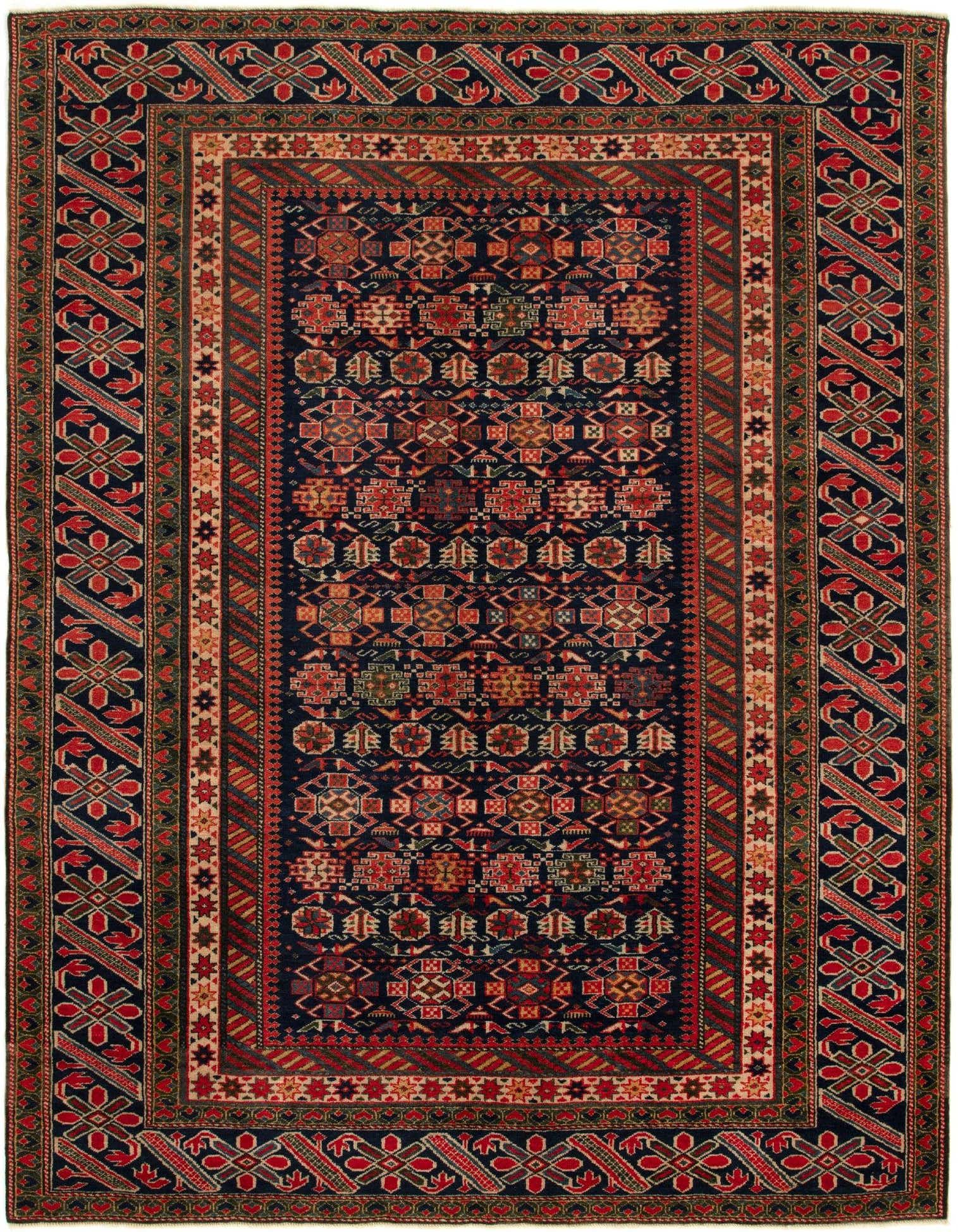 A 4x6 rectangular Schirwan wool rug featuring a dark navy field with intricate geometric patterns in red, green, and gold, framed by a multi-layered border in matching colors.